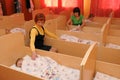 Kindergarten educators lay children in the afternoon nap