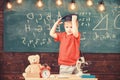 Kindergarten graduation concept. First former interested in studying, education. Kid boy in graduate cap ready to go to Royalty Free Stock Photo