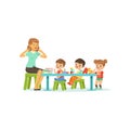 Kindergarten group of little kids, boys and girl doing exercises for development of speech with woman therapist. Flat Royalty Free Stock Photo