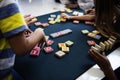 Kindergarten kids playing wooden alphabets letters vocabulary ga Royalty Free Stock Photo