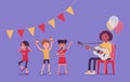 Kindergarten music party, black female teacher playing guitar