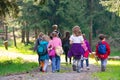 Kindergarten school children group family in forest