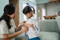 Kindergarten student wearing school uniform in the morning at home