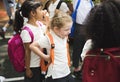 Kindergarten students with backpack standing together Royalty Free Stock Photo