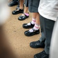 Kindergarten students feet standing together