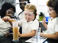 Kindergarten Students Mixing Solution in Science Experiment Laboratory Classr Royalty Free Stock Photo