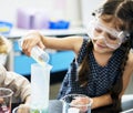 Kindergarten Students Mixing Solution in Science Experiment Laboratory Class Royalty Free Stock Photo