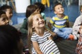 Kindergarten students sitting on the floor Royalty Free Stock Photo