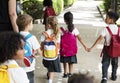 Kindergarten students standing holding hands Royalty Free Stock Photo