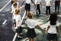 Kindergarten students standing holding hands to Royalty Free Stock Photo