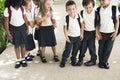 Kindergarten students standing together in scho Royalty Free Stock Photo