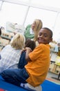 Kindergarten teacher reading to children Royalty Free Stock Photo