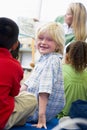 Kindergarten teacher reading to children Royalty Free Stock Photo