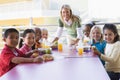 Kindergarten teacher supervising children