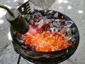 kindling coals for roasting meat on the grill using a gas Royalty Free Stock Photo