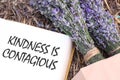 Kindness Is Contagious - inspirational phrase is shown using the text Royalty Free Stock Photo