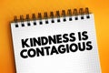 Kindness Is Contagious text on notepad, concept background Royalty Free Stock Photo