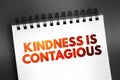 Kindness Is Contagious text quote on notepad, concept background Royalty Free Stock Photo