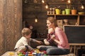 Kindness and education concept. Mother teaches son to be kind and friendly. Family play with teddy bear at home. Mom and Royalty Free Stock Photo