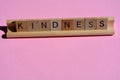 Mindness, word in wooden alphabet letters on tile rack