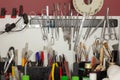 Kinds of tools for plastic modelling. Knives, brushes, scissors, tweezers, pins, clamps and others, set on special magnetic stand