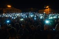 KINESHMA, RUSSIA - AUGUST 30, 2018: A crowd of people Shine with mobile phones at a live concert of rap artist Basta