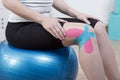 Kinesiology tapes on knee