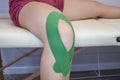 Kinesiotaping Medicine Rehabilitation on a woman