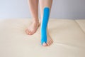 Kinesiotaping Medicine Rehabilitation on a woman