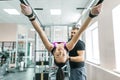 Kinesis technology, kinesitherapy, healthy lifestyle. Young woman doing rehabilitation exercises with personal instructor using Royalty Free Stock Photo
