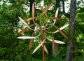 A kinetic copper dual wind spinner for outdoor garden decoration