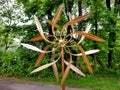 A kinetic copper dual wind spinner for outdoor garden decoration