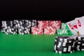 King, ace, black, red and green casino chips on table Royalty Free Stock Photo