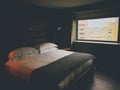 A king bed with a big window Royalty Free Stock Photo