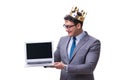 The king businessman holding a laptop isolated on white background Royalty Free Stock Photo