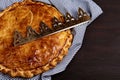 King cake or galette des rois in French. Traditional epiphany pie with golden paper crown Royalty Free Stock Photo