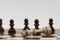 King in chess has fallen to several pawns Royalty Free Stock Photo