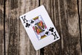 King of Clubs Card on Wood