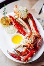 King Crab Cluster with sauces Royalty Free Stock Photo