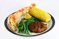 King Crab Leg Dinner with Corn Royalty Free Stock Photo