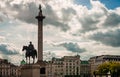 King George IV and the Nelson column against dramatic sky. Trafalgar Square, London Royalty Free Stock Photo