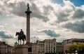 King George IV and the Nelson column in Trafalgar Square vs dramatic sky. Royalty Free Stock Photo