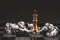 King golden chess standing of the falling silver chess with dark background