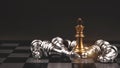 King golden chess standing in the middle of the falling silver on chess board Royalty Free Stock Photo