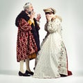 King man, queen and argue in studio with anger, frustrated and crying in relationship, theater and drama. Medieval royal