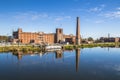 King Mill and brick buildings downtown Augusta and reflections in the Canal