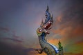 King of Nagas, Great Naga on sunset sky, sculpture found in the Buddhism temples, Wat Rong Sua Ten, Chiang Rai, Thailand