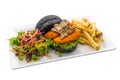 King Oyster patty burger with Swiss Mushroom Sauce with fries and salad served in dish isolated on plain white background side