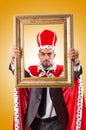 King with picture frame on white Royalty Free Stock Photo