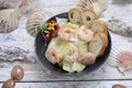 King prawn salad. Marine composition with a bowl of shrimp salad with iceberg lettuce, on a white wood table, top view. Royalty Free Stock Photo
